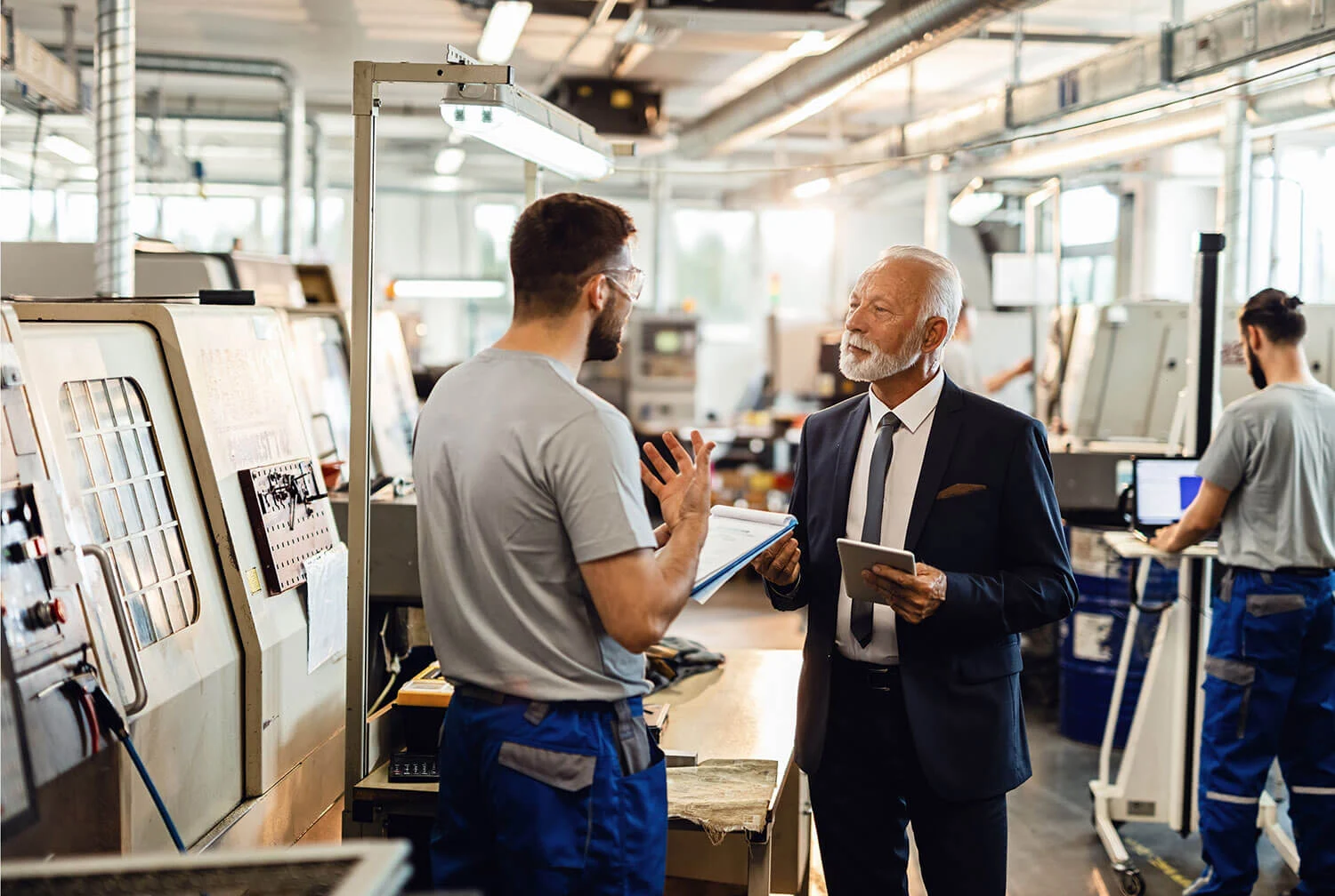 Manufacturing workers in discussion