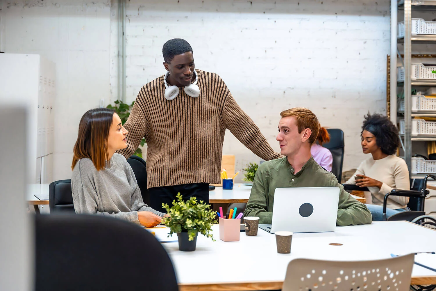 Creative office workers talking