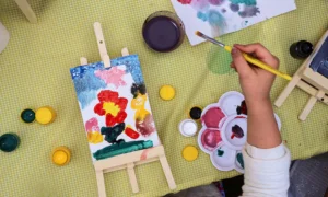 Child painting a flower